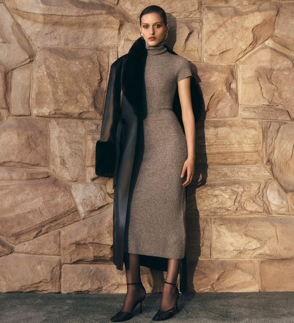 Image of woman in grey knit dress.