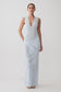 Woman wearing a light blue floral knit maxi dress.