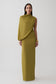 Woman wearing a green gather sleeve maxi dress.