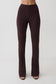 Woman wearing brown skinny flare pants.