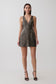 Woman wearing a silver beaded metal mini dress.