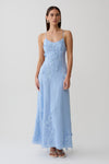 Woman wearing a blue floral lace midi dress.