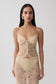 Woman wearing gold sweetheart lace top.