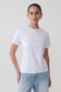 Woman wearing a white cotton oversized t-shirt.