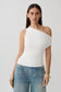 Woman wearing a white short sleeve draped hardware top.