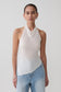 Woman wearing a white relaxed sheer halter top.