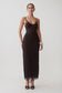 Woman wearing a dark brown lace and mesh midi dress.