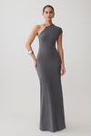 Woman wearing a grey slinky maxi dress with hardware.