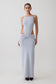 Woman wearing a light blue sleeveless maxi dress.