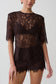 Woman wearing  dark brown shoulder pad short sleeve lace top with matching mini shorts.