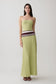 Woman wearing a ligth green strapless contrast knit maxi dress.