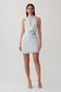 Woman wearing light blue chiffon and lace halter mini dress.