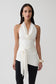 Woman wearing a white front tie halter top.