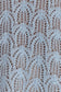 Close-up of a textured light blue crochet fabric.