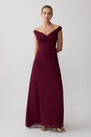 Woman wearing a burgundy off-shoulder maxi dress.