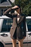 Image of woman in brown tweed blazer