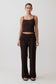 Woman wearing a brown boucle sleeveless top and matching wide-leg pants.