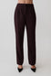 Women wearing dark brown striped pants.