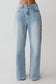 Light blue straight leg jeans with frayed hem.