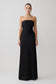 Woman wearing a black strapless gown on a white background