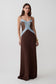 Woman wearing a brown and blue knit and lace maxi dress.