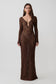 Woman wearing a brown lurex crochet long-sleeve dress.