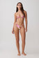 Woman wearing a beaded pink floral bikini set.