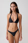 Woman wearing a black bikini set.