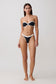 Woman wearing a black and white bikini set.