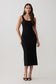 Woman wearing a black stretch crepe mini dress.