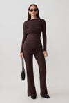 Woman wearing a brown modal straight leg overlay pant with matching top.