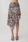 Woman wearing a zebra print chiffon midi skirt. 