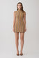 Woman wearing a brown and orange striped sleeveless mini dress.