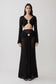 Woman wearing crochet long sleeve cropped top with matching maxi skirt.