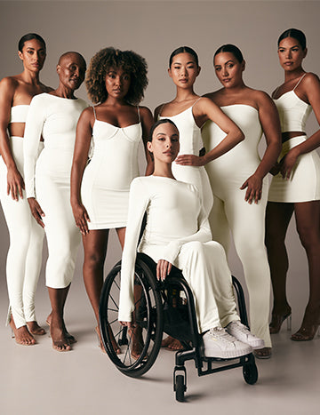 Image of a group of diverse women wearing white outfits