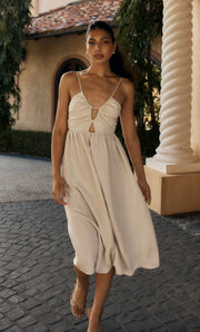 Image of woman in nude linen dress.