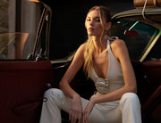 Image of woman in ivory two piece set.