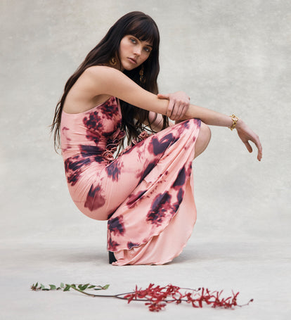 Image of woman in pink maxi dress.